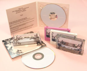 A matching set of CDs in digipaks with pink, white and glitter cassettes