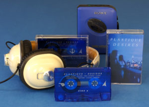 Tranparent blue cassette shells with silver on-body printing, packed in clear cases with full colour J-cards