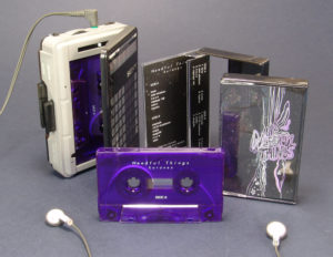 Transparent purple cassettes with white on-body printing and packed in black-back cases