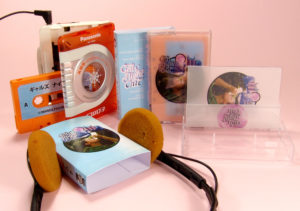 Tangerine cassettes in clear cases with clear vellum J-cards and outer oversized O-cards