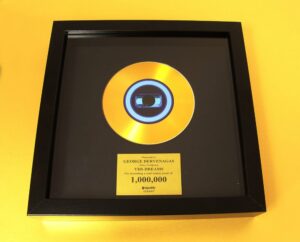 Gold vinyl CD in frame for George Dervenagas