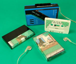 Cream cassette tapes in black cases with printed J-cards and then cellophane wrapped