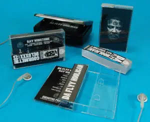 Black cassettes with sticker printing in cases with J-cards and obi strips