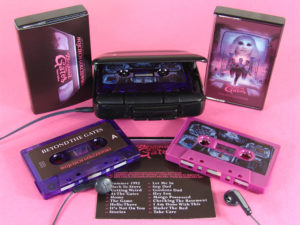 Blackberry purple and transparent purple cassettes in black cases with printed J-cards and outer O-cards