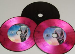 Black based CDs with a full colour on-body print and vinyl rings added on top