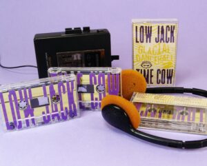 Metallic gold liner cassettes with purple full coverage UV LED printing and eco-natural recycled cardstock J-cards