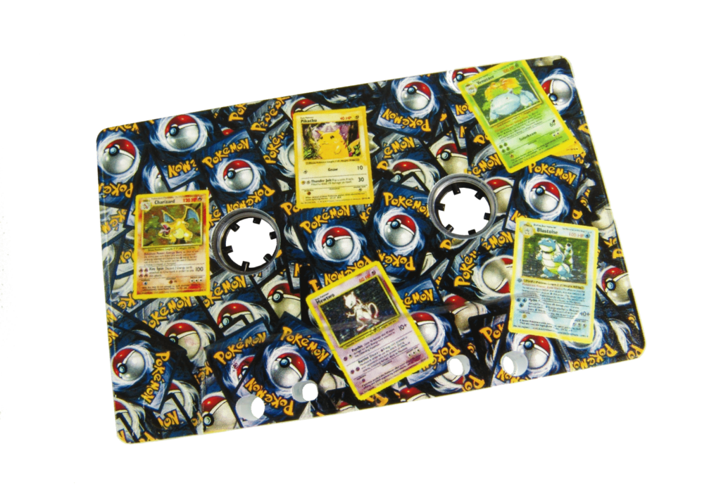 Clear cassette with a full coverage print using a white base, with spot gloss lacquer on the Pokemon cards to make them shiny