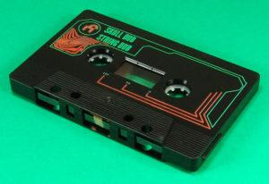 Black cassettes with green and orange on-body printing