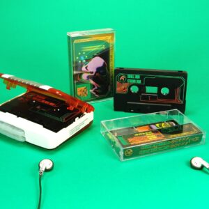 Black cassettes in standard cases with green and orange on-body printing