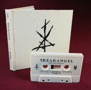 Cream linen hardback digipak with a cream colour cassette tape, both with black on-body printing