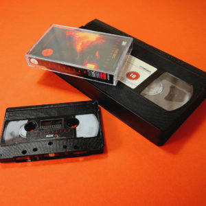 Black audio cassettes with full coverage UV LED printing to give the effect of an old VHS tape