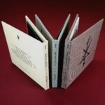 Printed hard cover linen digipaks in cream and rock fine linen, plus coarse brown linen with glued-in booklets