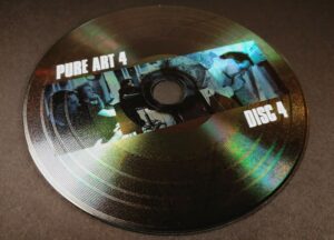 Custom printed vinyl CD with a picture under the grooves and a white print on top of the grooves