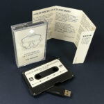 Black USB memory stick cassettes in cases with printed J-cards