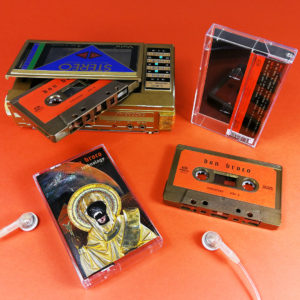 Antique bronze cassette tapes with stickers and J-cards