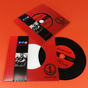 Black vinyl CDs in record-style wallets with obi strips