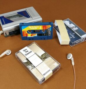 Petrol blue cassette tapes in clear cases with obi strips