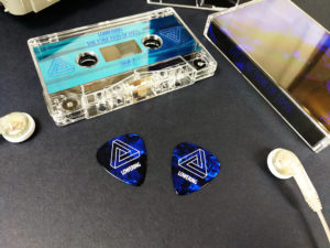 Dark blue guitar picks to match the on-body artwork of a cassette release
