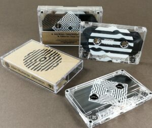 Clear tapes with silver liners and a full coverage white UV-LED print, plus printed brown Manila J-cards