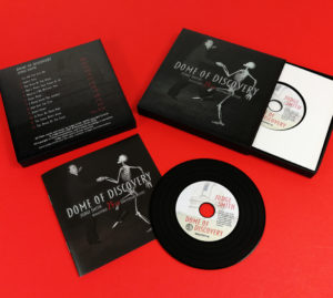 Black vinyl CDs in presentation matchbox cases with 12 page booklets