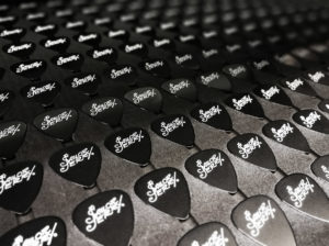 Our guitar pick print bed in the UV LED printer, printing over 250 at once!