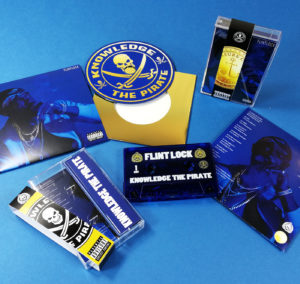 Vinyl-style CDs in metallic gold wallets and printed over-sized outer wallets, plus cassette tapes with Obi strips