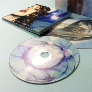 Spot gloss printed CDs in 4 page digipaks with 16 page booklets