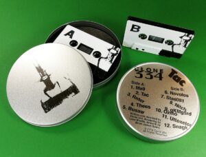 Black tapes with full coverage white on-body printing in printed metal tins