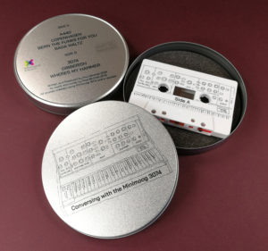Lid and base printed cassette tape tins with on-body printing on the tapes