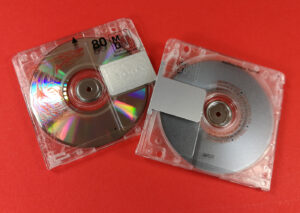 Clear MiniDiscs with red and black on-body printing