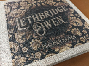 Full colour cover printing on a light brown coarse linen digipak