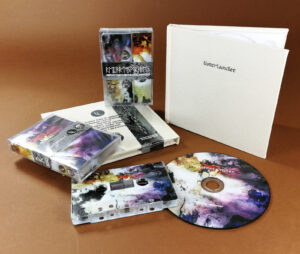 Full coverage on-body print cassette tapes and CDs in hardback cream linen fabric digipacks