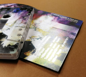 Silver metallic foil printing over a full colour cassette tape J-card print