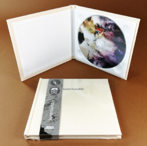 UV-LED printed CDs in hardback cream linen fabric digipacks with an obi strip