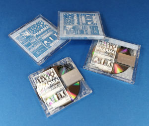 White on-body printing on the MiniDiscs, packed in clear cases with printed inserts