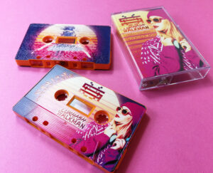 Tangerine orange cassettes with full coverage, full colour printing with a full coverage spot gloss finish