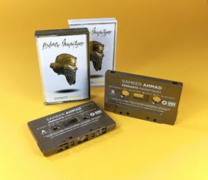 Vintage bronze cassette tapes with white on-body printing in gold and white cassette cases with clear front windows