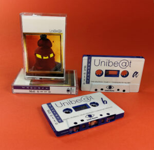 Dark blue cassette tapes with full colour on-body UV-LED printing in cases with J-cards