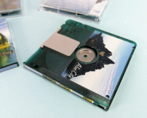 Close-up of green MiniDiscs with full colour on-body top, underside and spine printing