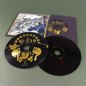 Premium vinyl CDs in record-style card sleeves with outer printed wallets