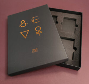 Copper metallic foil printing on a black A4 quad cassette tape presentation box