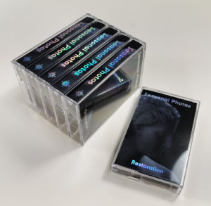 Holographic hot foil metallic printing on full colour printed cassette tape J-cards
