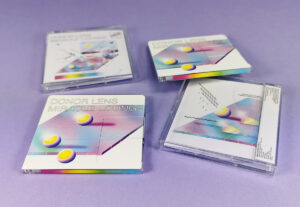 Clear MiniDiscs with colourful on-body spine and top printing, packed in jewel cases with J-cards