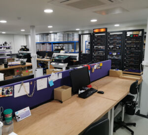 Main production area showing the tape decks and two Mimaki UV-LED printers