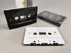 Black and white sandwich tapes with gold on-body printing and a spot gloss over the gold printing