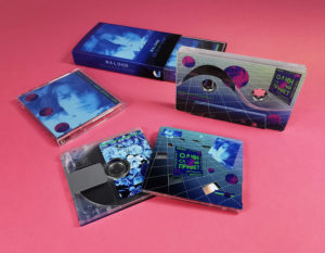 Matching cassette tape and MiniDisc set with partial reveals of the clear tapes and MiniDiscs underneath