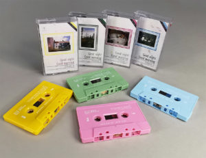 A set of yellow, sage green, baby pink and sky blue cassette tapes