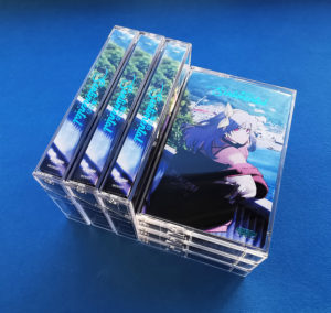 Turquoise metallic hot foil printing on cassette tape J-cards