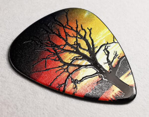 Black guitar pick with full colour printing and a clear spot gloss over the tree