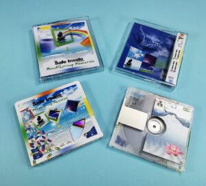 MiniDiscs with partial white and colour front prints to reveal a section of the MiniDisc